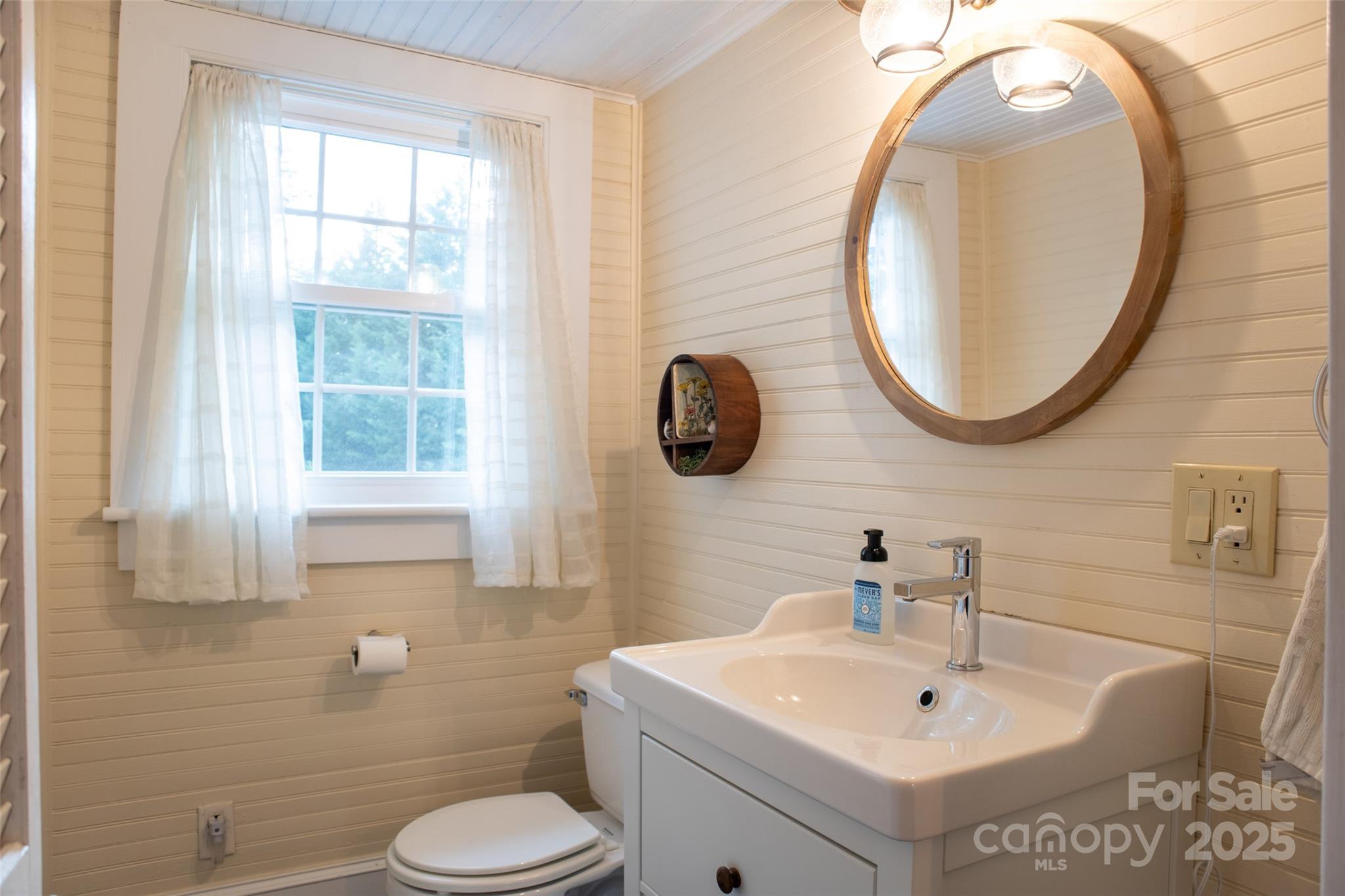 102 Cuthberson Street Morganton, NC 28655 - Photo 31 of 45 a bathroom with a toilet sink and mirror