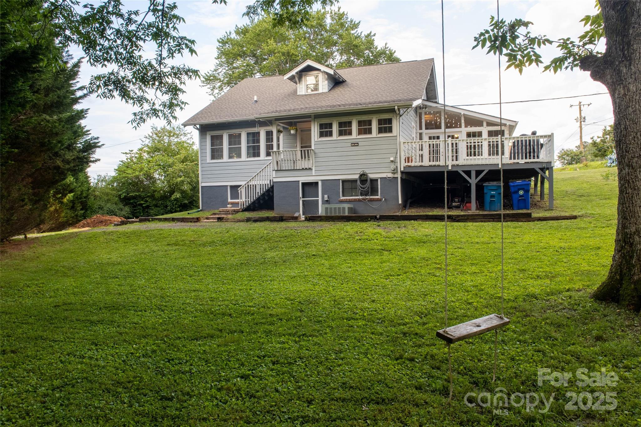 102 Cuthberson Street Morganton, NC 28655 - Photo 38 of 45 a view of a house with a big yard and large trees