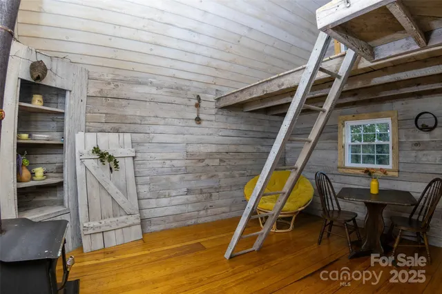 a view of a chairs and table in the balcony