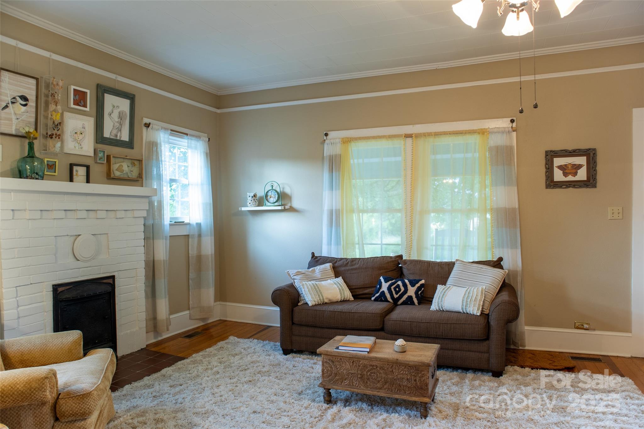 102 Cuthberson Street Morganton, NC 28655 - Photo 7 of 45 a living room with furniture and a fireplace