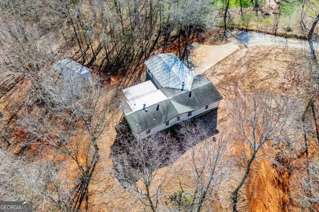 a view of a yard with large trees