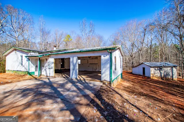 a view of a house with roof deck front of house