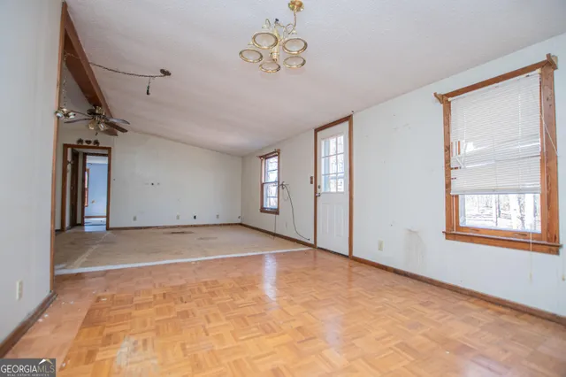 a view of an empty room with a window