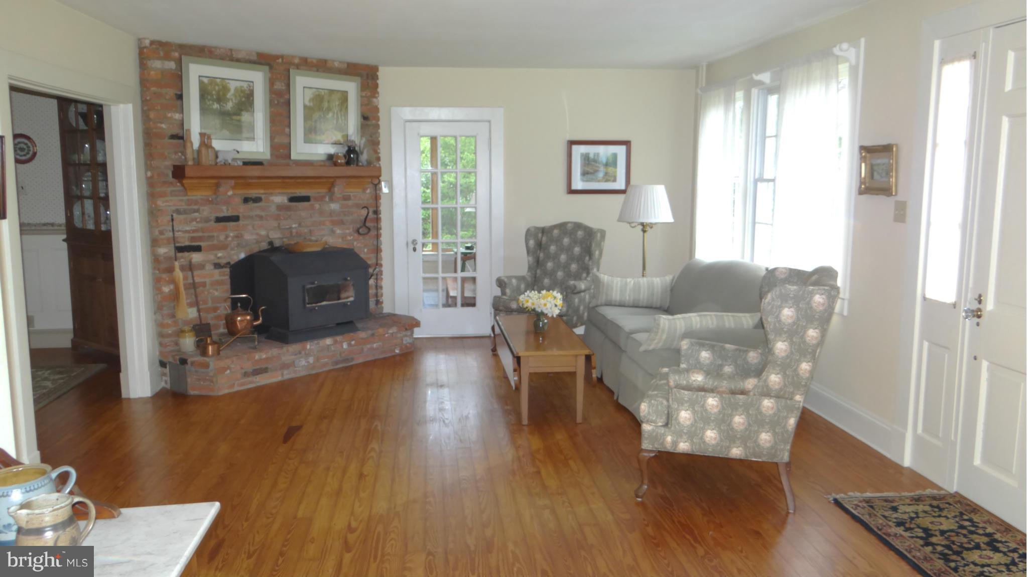 832 Maple Road Gambrills, MD 21054 - Photo 9 of 30 Living Room with Wood Stove