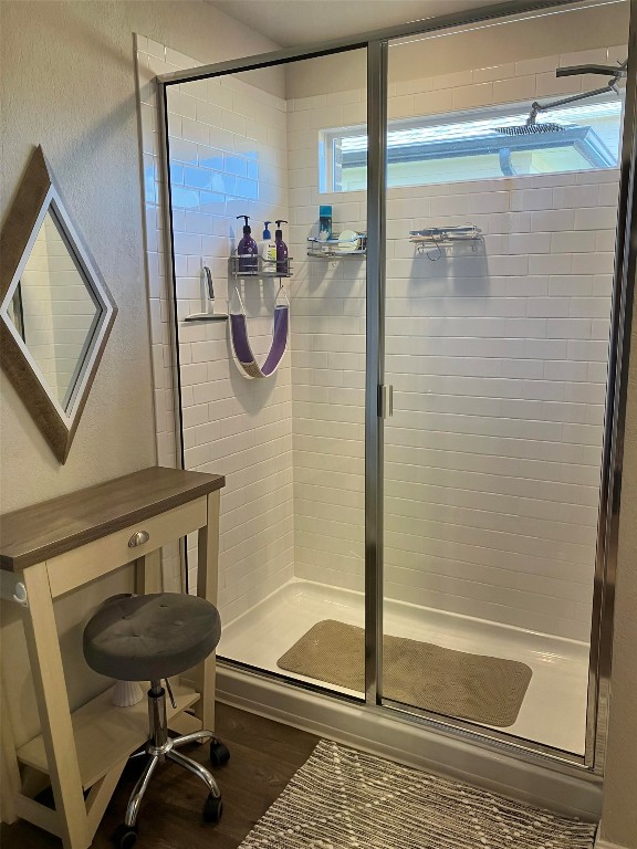 119 Mercer Street Bastrop, TX 78602 - Photo 13 of 19 a bathroom with a sink a mirror and a glass door shower