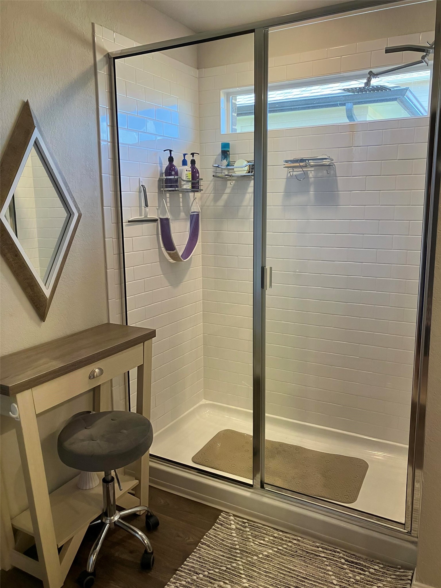 119 Mercer Street Bastrop, TX 78602 - Photo 13 of 19 Full bath with dark wood finished floors and a stall shower