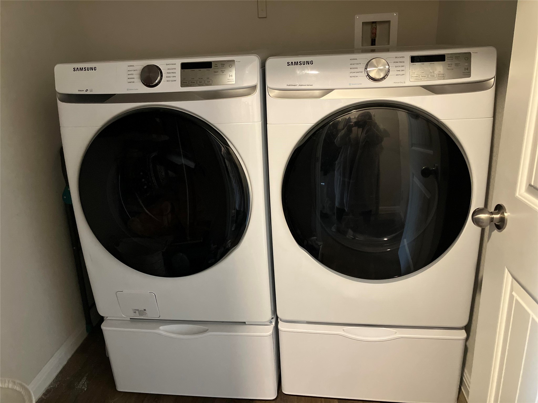 119 Mercer Street Bastrop, TX 78602 - Photo 3 of 19 Laundry room featuring washing machine and dryer and wood finished floors