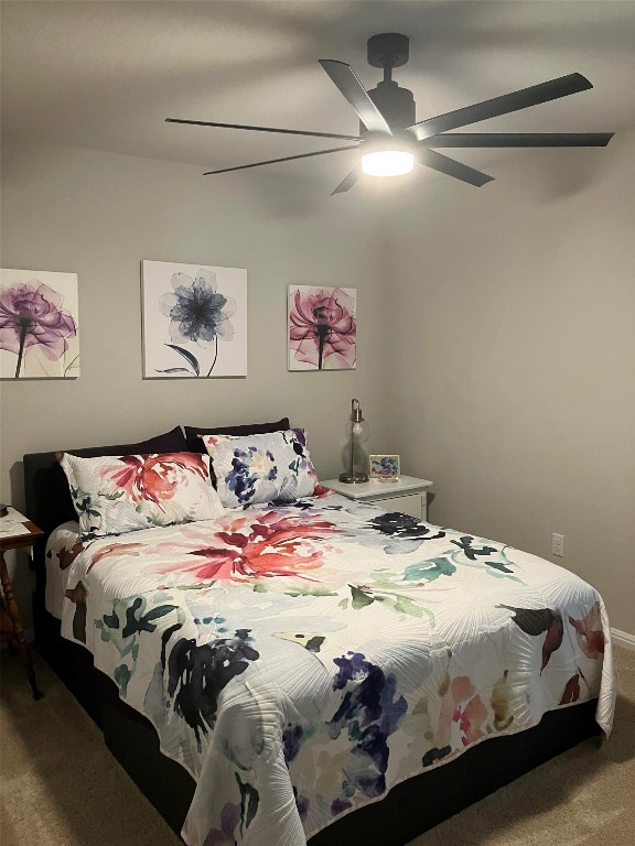 119 Mercer Street Bastrop, TX 78602 - Photo 8 of 19 a bedroom with a bed and a painting on the wall