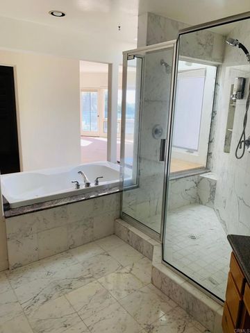 a bathroom with a tub and a sink