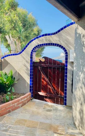 a front view of a house with large windows