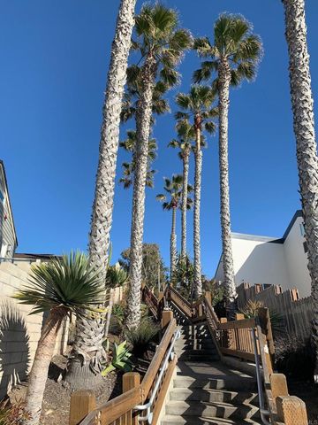 a view of roof deck with chairs and wooden floor