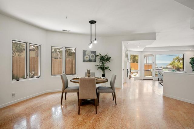 a view of a livingroom with furniture window and wooden floor
