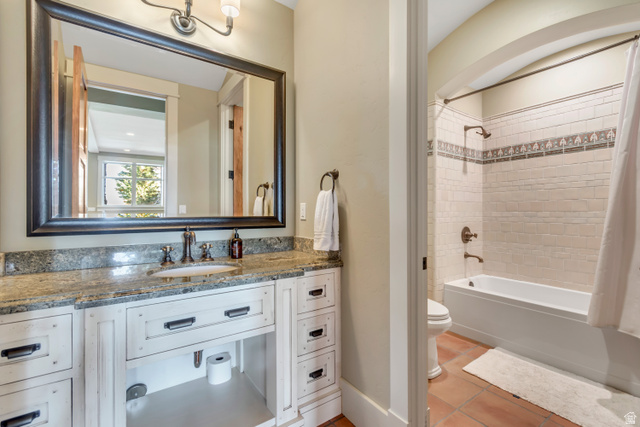 2579 Splendor Valley Road Kamas, UT 84036 - Photo 64 of 87 Full bathroom featuring vanity, shower / bath combo with shower curtain, and light tile patterned flooring