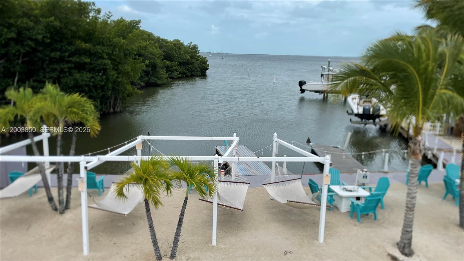 325 Calusa Street Key Largo, FL 33037 - Photo 12 of 19 a view of an chairs and tables in the patio