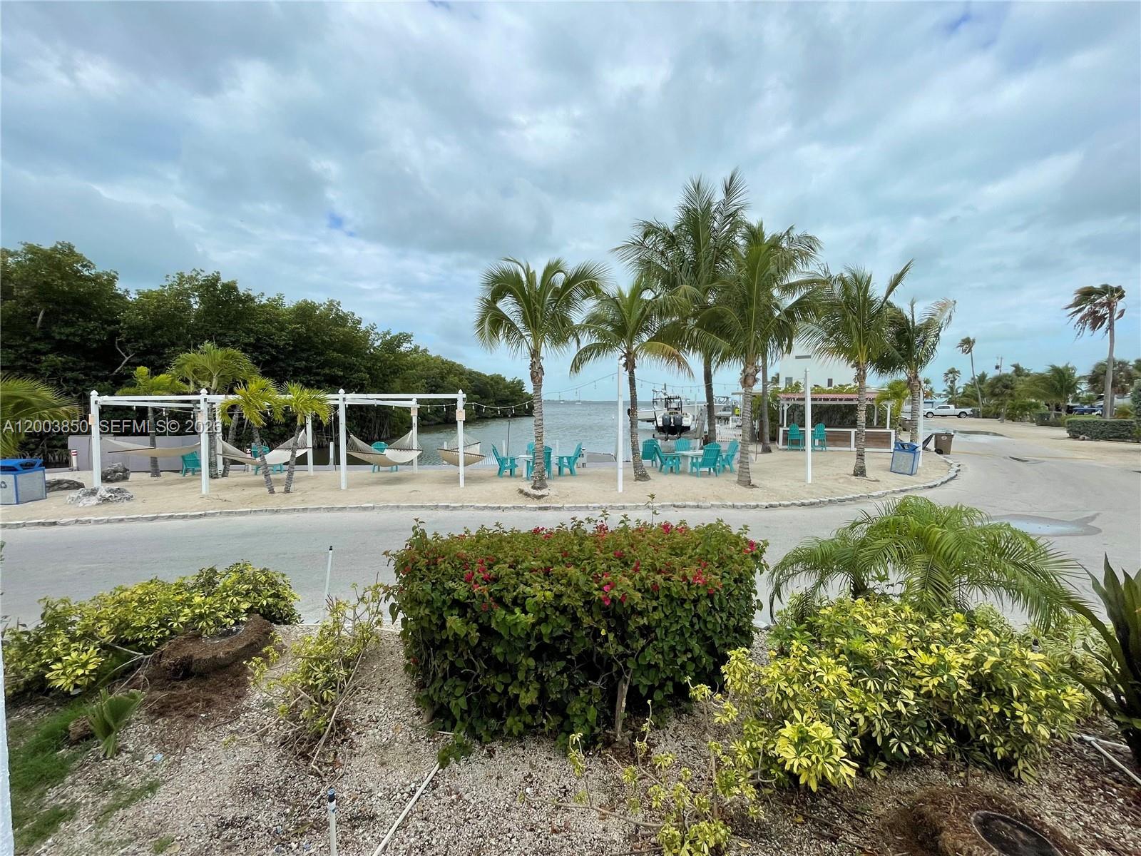 325 Calusa Street Key Largo, FL 33037 - Photo 16 of 19 a view of a garden
