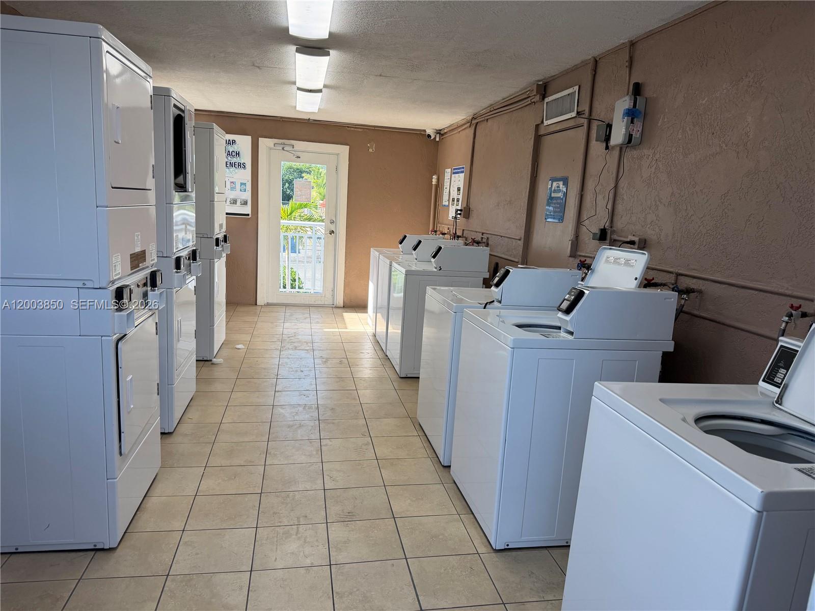 325 Calusa Street Key Largo, FL 33037 - Photo 19 of 19 a view of a storage & utility room with a washer dryer