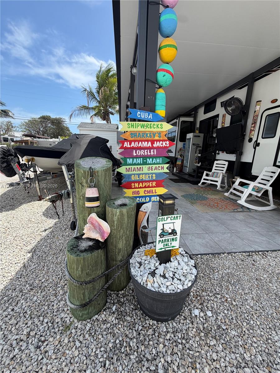325 Calusa Street Key Largo, FL 33037 - Photo 2 of 19 a room with toys and flowers