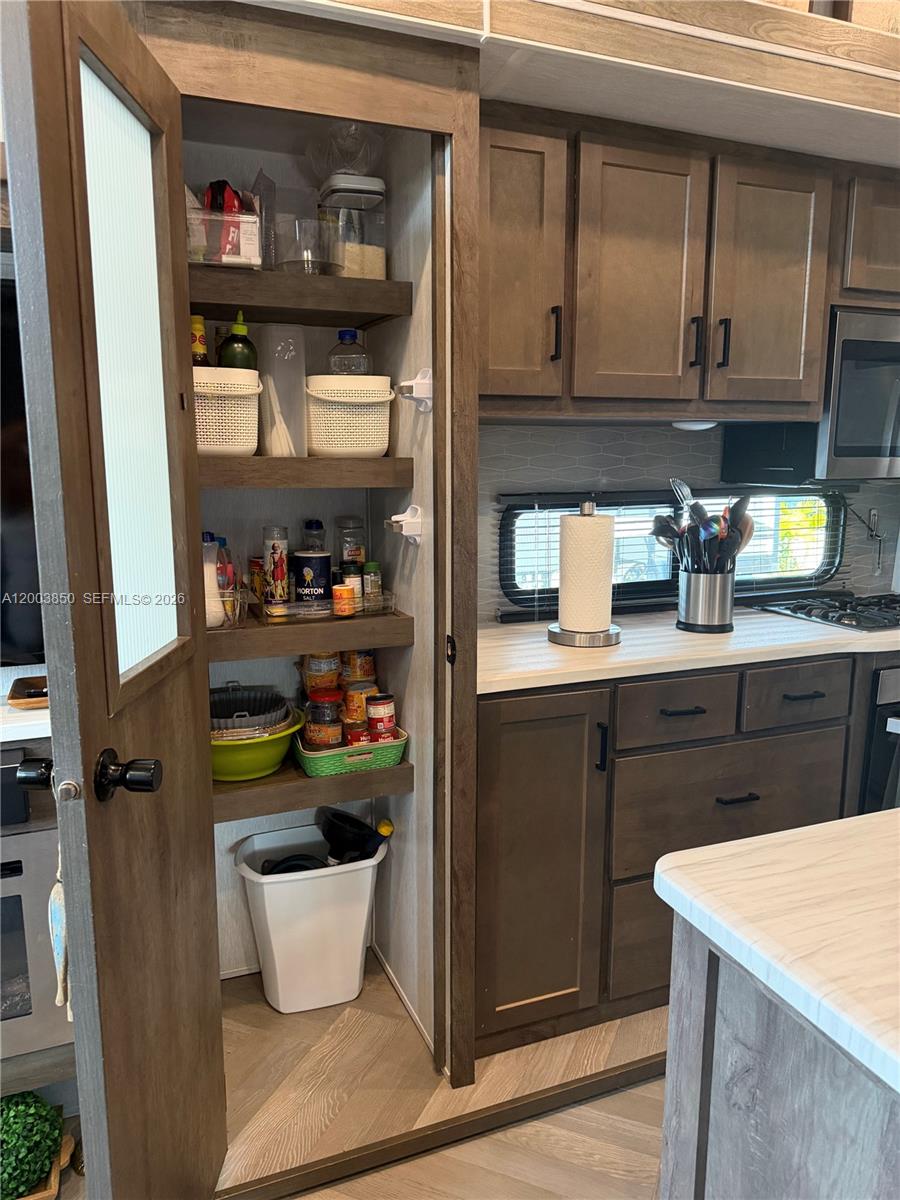 325 Calusa Street Key Largo, FL 33037 - Photo 4 of 19 a kitchen with a sink and wooden floor