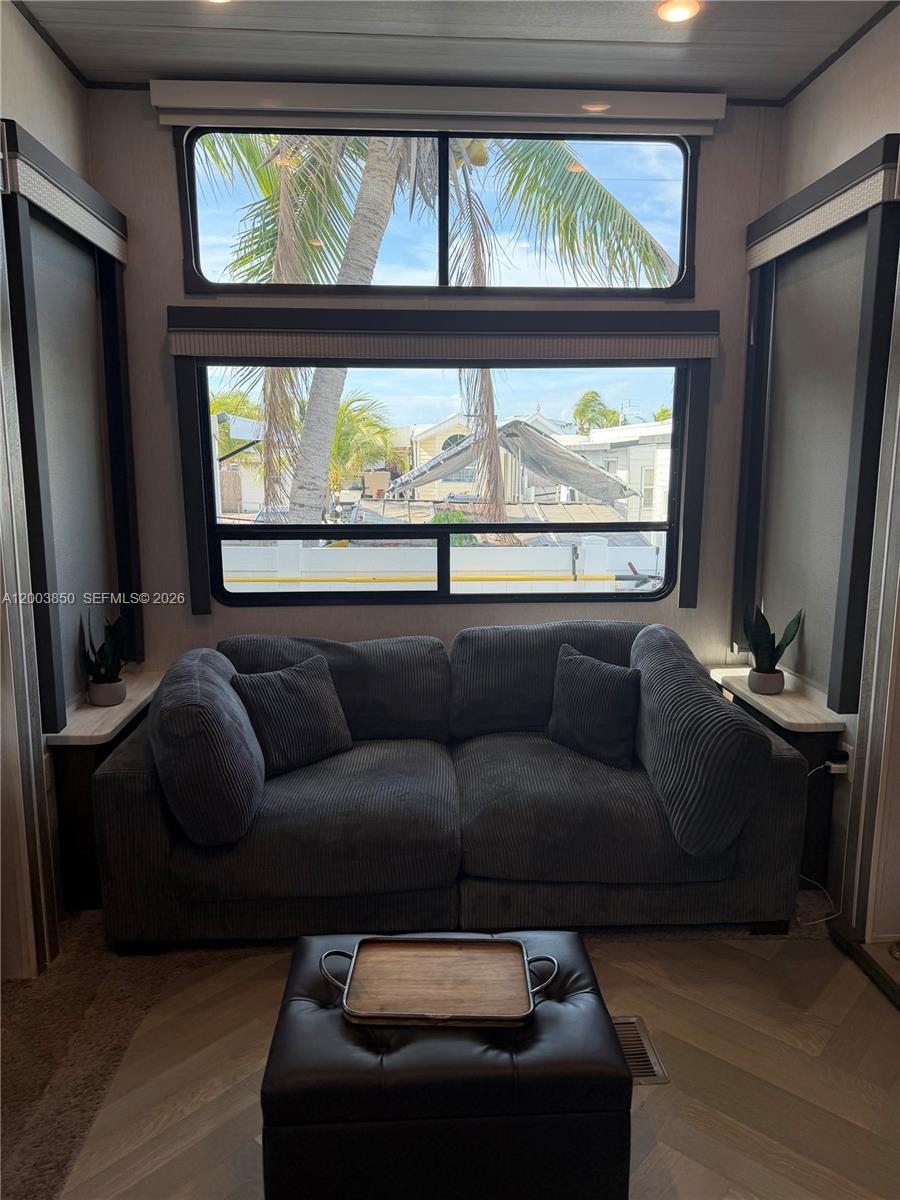 325 Calusa Street Key Largo, FL 33037 - Photo 8 of 19 a living room with furniture and a flat screen tv