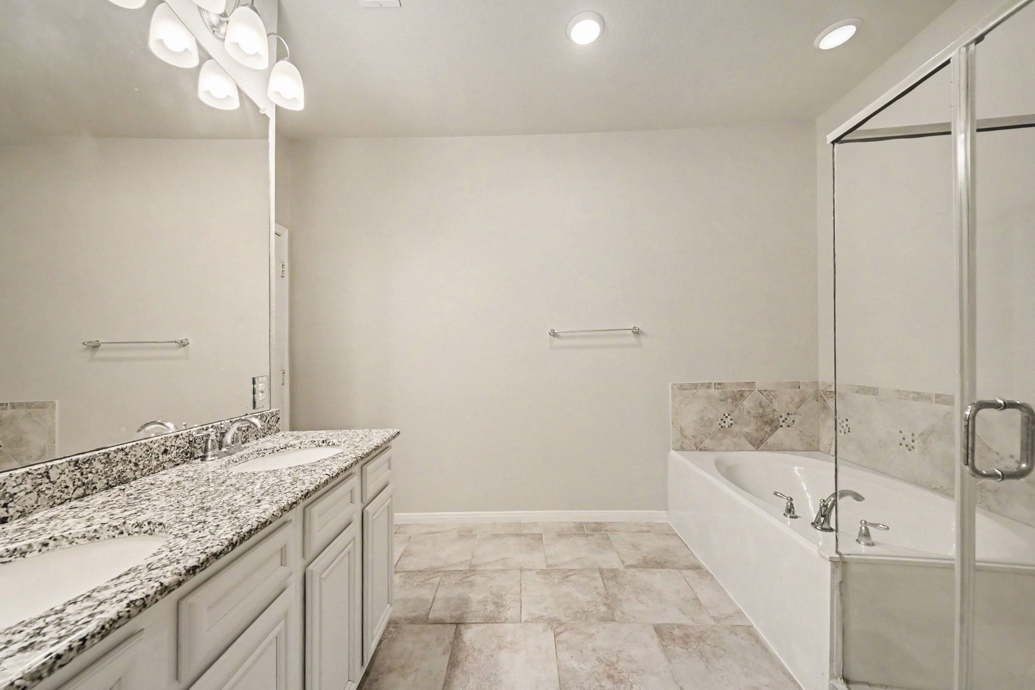 24554 Grayson Falls Lane Spring, TX 77389 - Photo 15 of 27 a bathroom with a granite countertop sink a toilet and bathtub