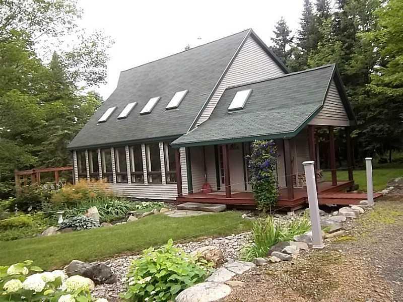 247 Mingo Loop Road Rangeley, ME 04970 - Photo 28 of 34 Exterior Front. Property landscaped...