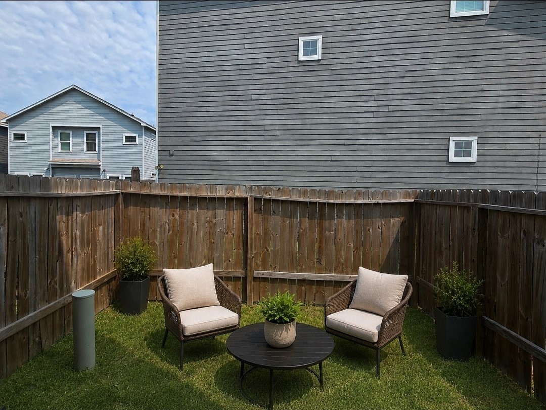 4902 Paradigm Ln Spring Spring, TX 77379 - Photo 23 of 24 a view of a patio with couches chairs and a potted plant