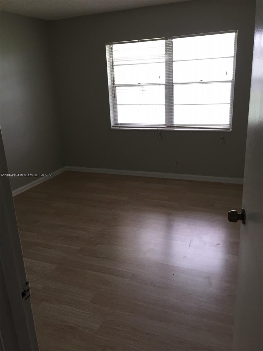 182 Markham I, Unit 182 Deerfield Beach, FL 33442 - Photo 7 of 7 a view of a window in a room