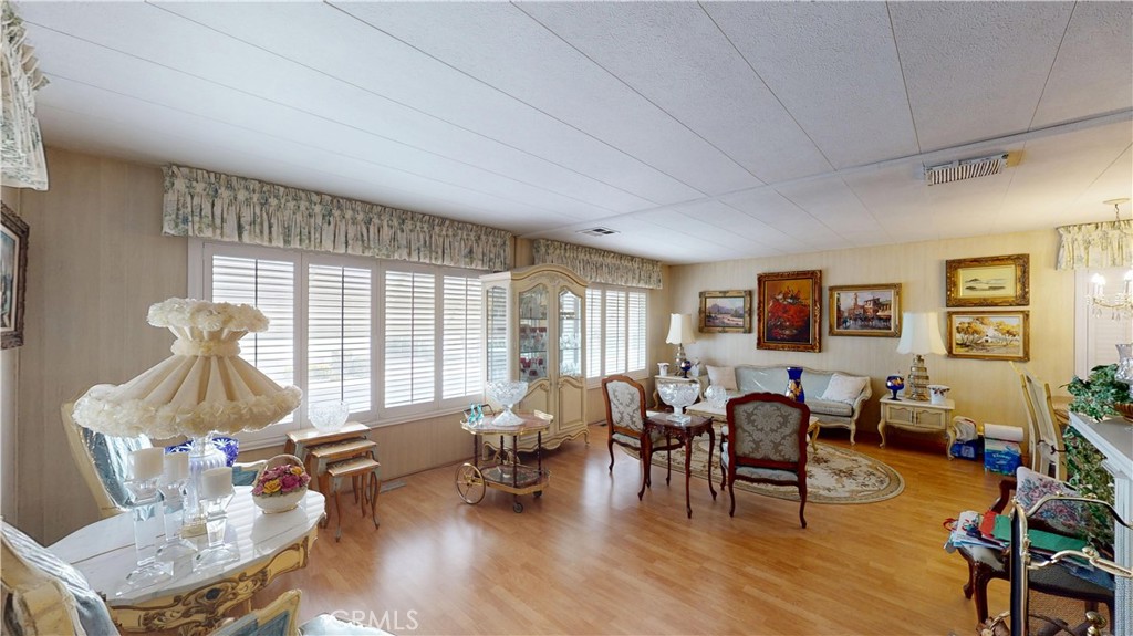 14851 Jeffrey Road, Unit 117 Irvine, CA 92618 - Photo 10 of 45 a living room with furniture and wooden floor