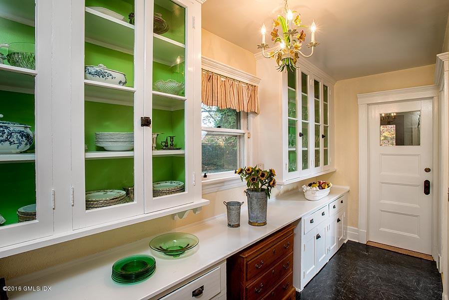45 Sinawoy Road Cos Cob, CT 06807 - Photo 11 of 18 a bathroom with a sink mirror and next to a window