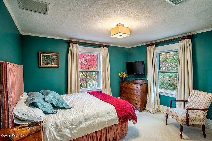 45 Sinawoy Road Cos Cob, CT 06807 - Photo 13 of 18 a bedroom with a bed and flat screen tv