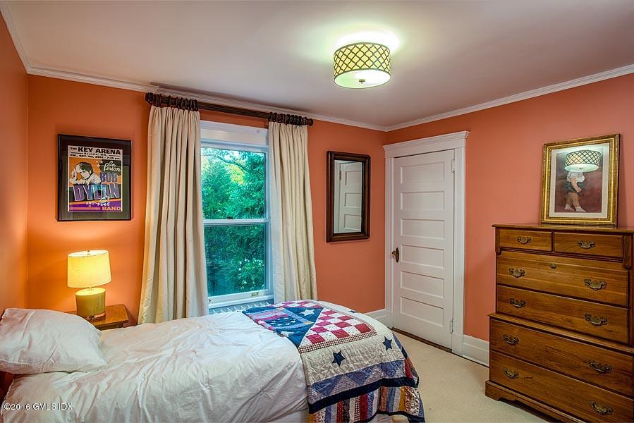 45 Sinawoy Road Cos Cob, CT 06807 - Photo 14 of 18 a bedroom with a bed and a dresser next to a window