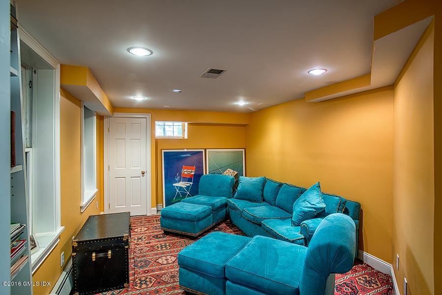 45 Sinawoy Road Cos Cob, CT 06807 - Photo 15 of 18 a living room with furniture and a flat screen tv