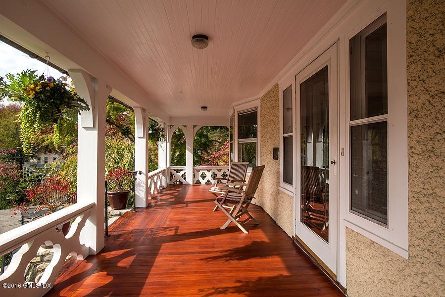 45 Sinawoy Road Cos Cob, CT 06807 - Photo 3 of 18 a view of a balcony with chairs and wooden floor