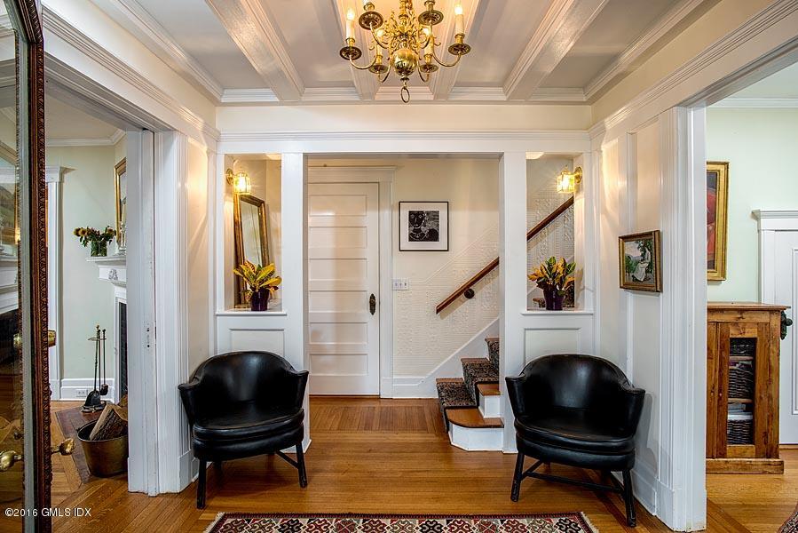 45 Sinawoy Road Cos Cob, CT 06807 - Photo 5 of 18 a living room with furniture a fireplace and a flat screen tv