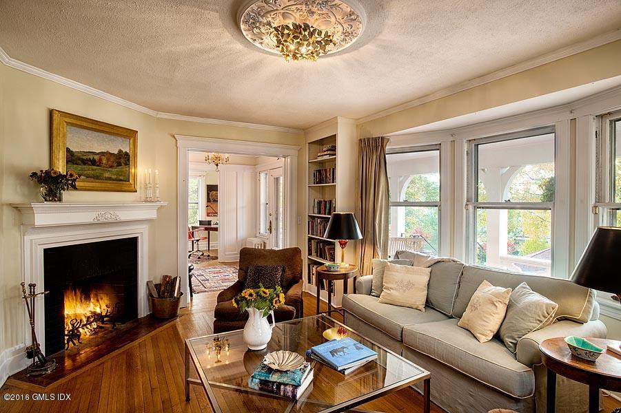 45 Sinawoy Road Cos Cob, CT 06807 - Photo 7 of 18 a living room with furniture and a fireplace