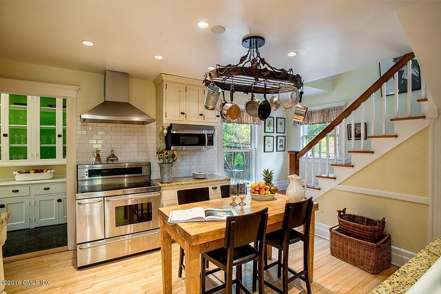 45 Sinawoy Road Cos Cob, CT 06807 - Photo 10 of 18 a kitchen with stainless steel appliances a stove a table and chairs