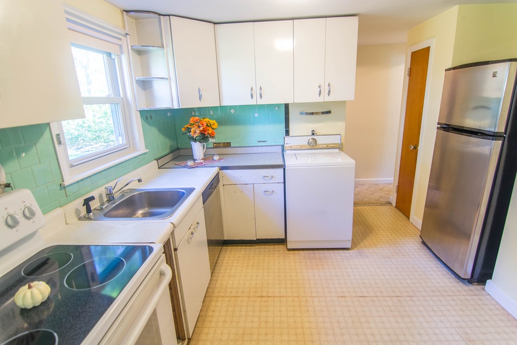 13 Wethersfield Road Natick, MA 01760 - Photo 5 of 11 a kitchen with a sink appliances and cabinets