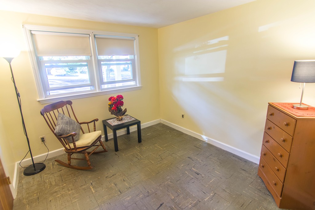13 Wethersfield Road Natick, MA 01760 - Photo 7 of 11 a living room with furniture and a window