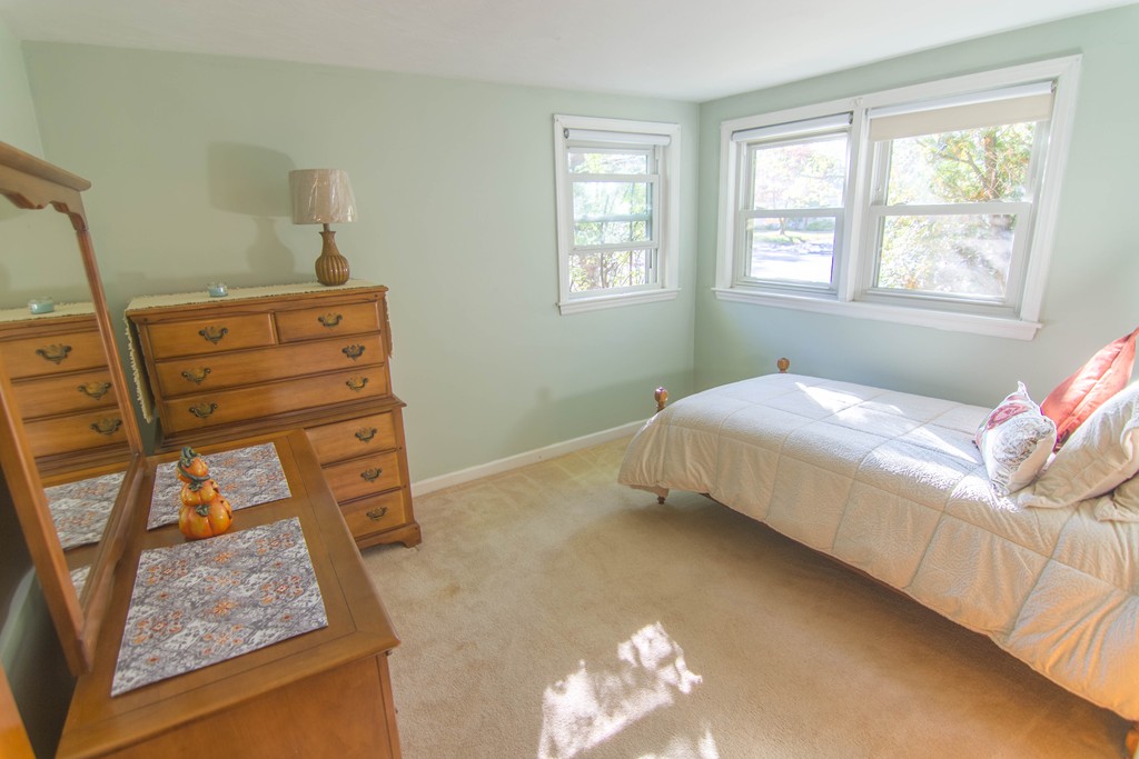 13 Wethersfield Road Natick, MA 01760 - Photo 8 of 11 a bedroom with a bed and a window
