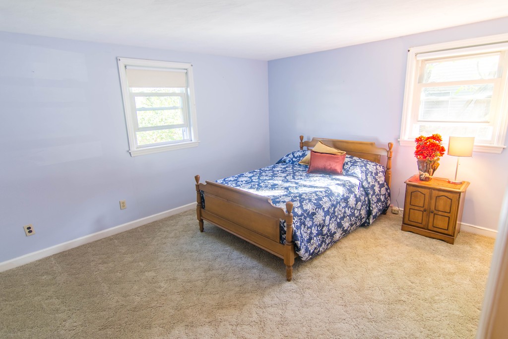13 Wethersfield Road Natick, MA 01760 - Photo 9 of 11 a bedroom with a bed and a window