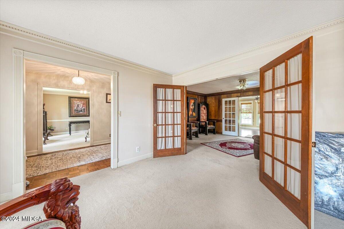 5369 Rivoli Drive Macon, GA 31210 - Photo 14 of 40 an empty room with furniture and floor to ceiling window