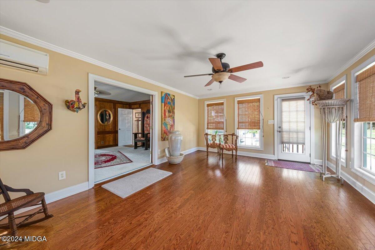 5369 Rivoli Drive Macon, GA 31210 - Photo 19 of 40 a view of an empty room with window and wooden floor