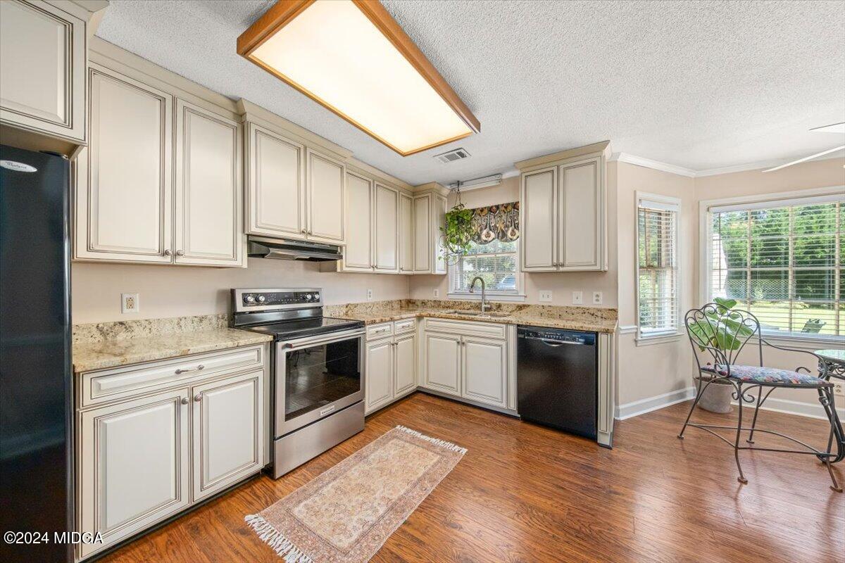 5369 Rivoli Drive Macon, GA 31210 - Photo 22 of 40 a kitchen with a white cabinets and white appliances