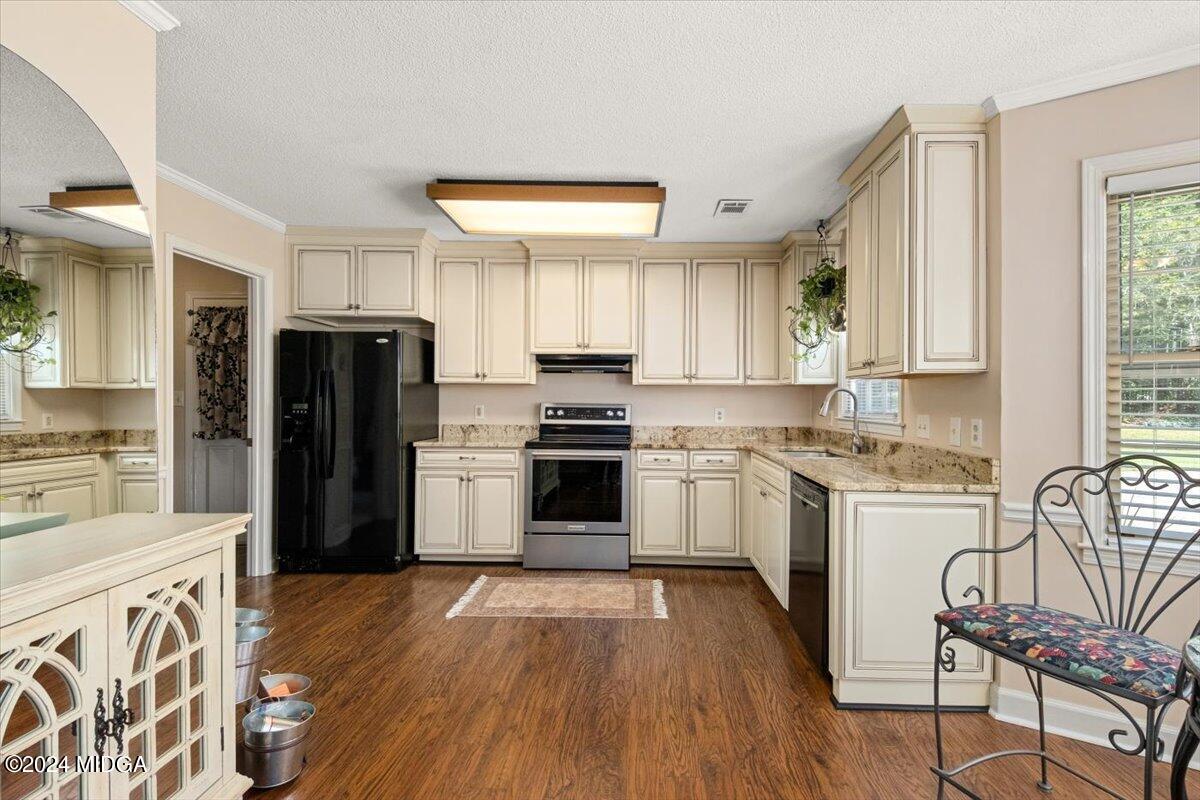 5369 Rivoli Drive Macon, GA 31210 - Photo 24 of 40 a kitchen with granite countertop a refrigerator stove top oven and sink