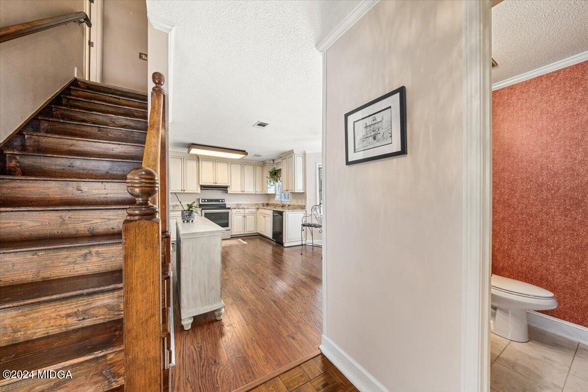 5369 Rivoli Drive Macon, GA 31210 - Photo 26 of 40 a living room with couches and a view of kitchen