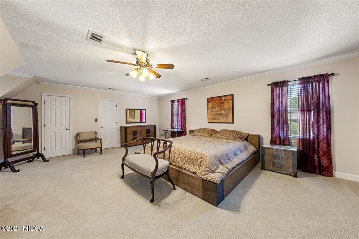 5369 Rivoli Drive Macon, GA 31210 - Photo 30 of 40 a living room with furniture and a flat screen tv