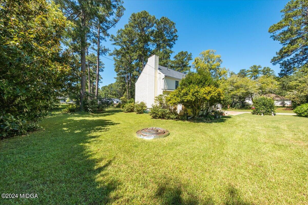 5369 Rivoli Drive Macon, GA 31210 - Photo 8 of 40 a backyard of a house with lots of green space