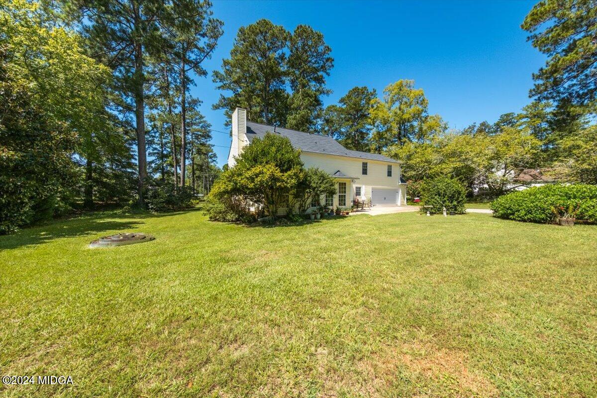 5369 Rivoli Drive Macon, GA 31210 - Photo 9 of 40 a view of a yard with plants and trees