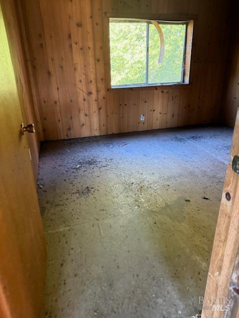 14180 Poonkinney Road Dos Rios, CA 95429 - Photo 7 of 18 a view of an empty room with wooden floor and a window