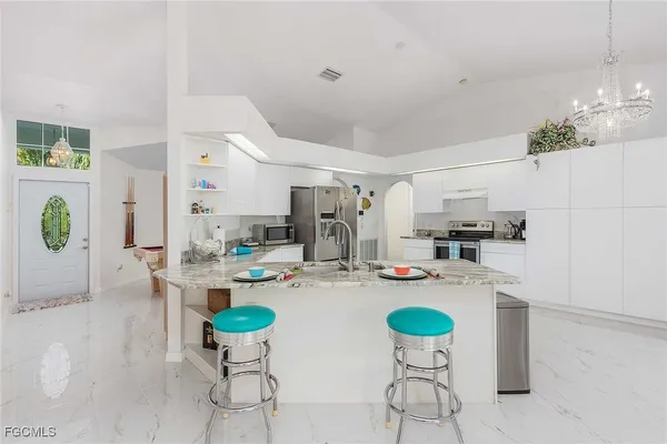 a dining room with furniture and window